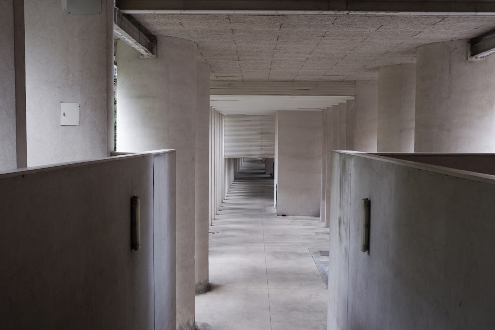 a long hallway in a building with no doors