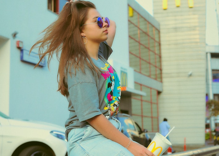 shallow focus photo of woman in gray T-shirt