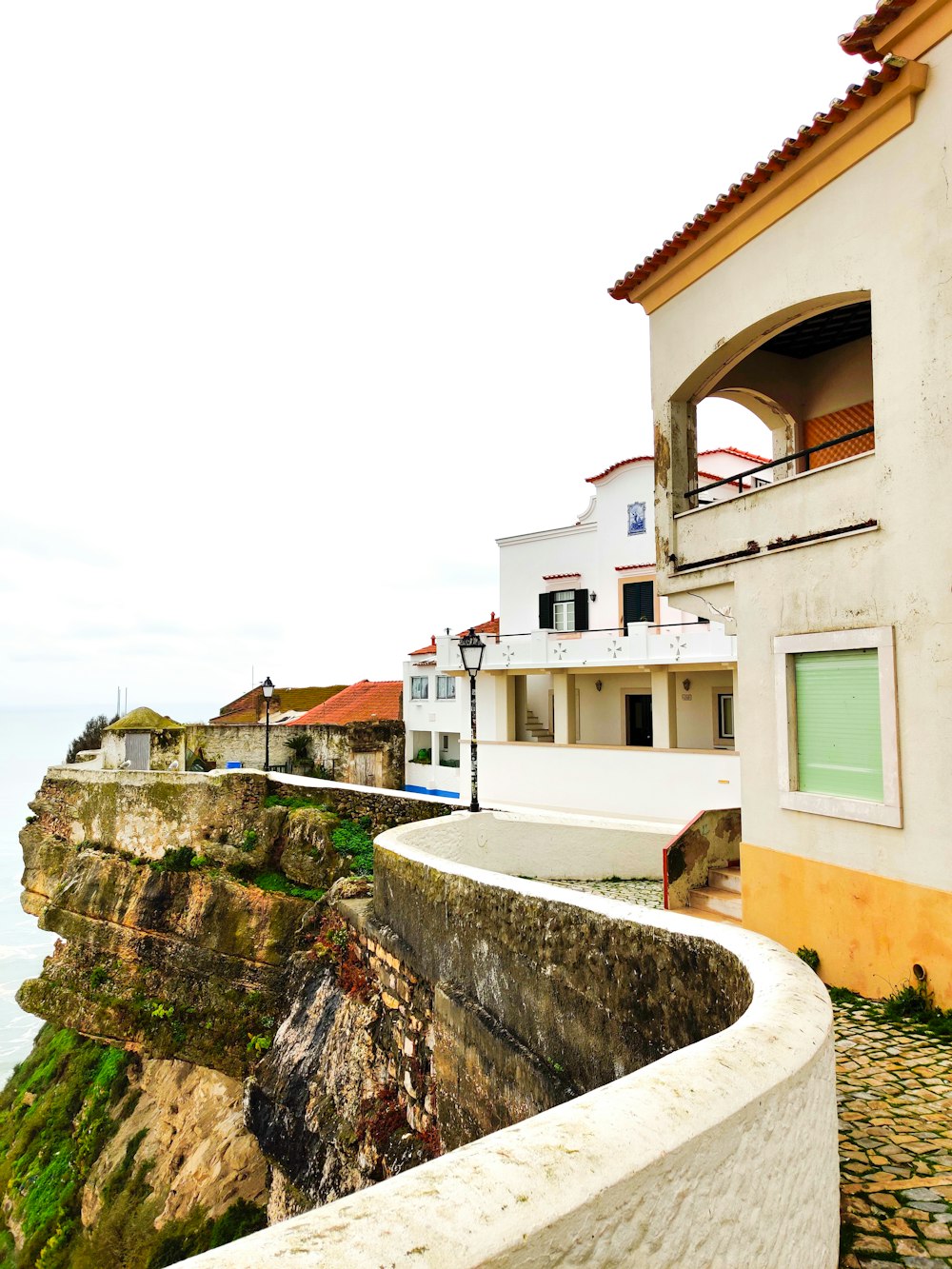 buildings on cliff during daytime
