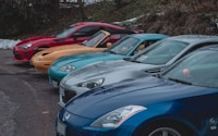 five assorted-color vehicles on road