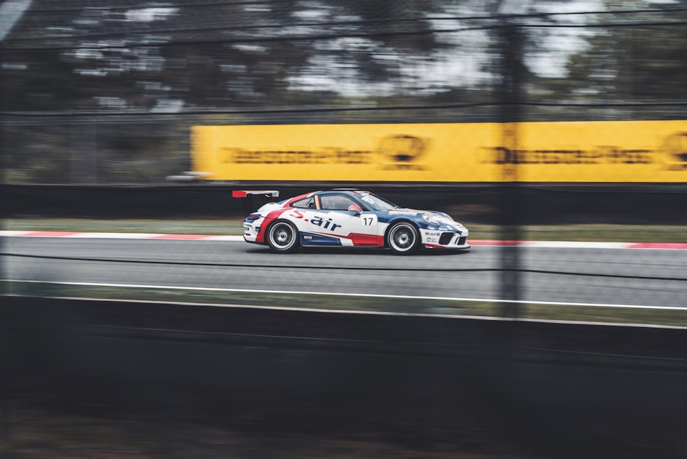 white, red, and black racing car