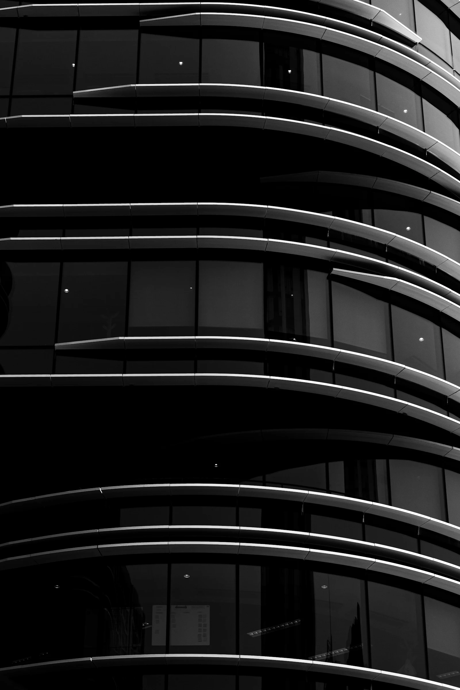 Sydney Opera House sails in black and white against a pale sky