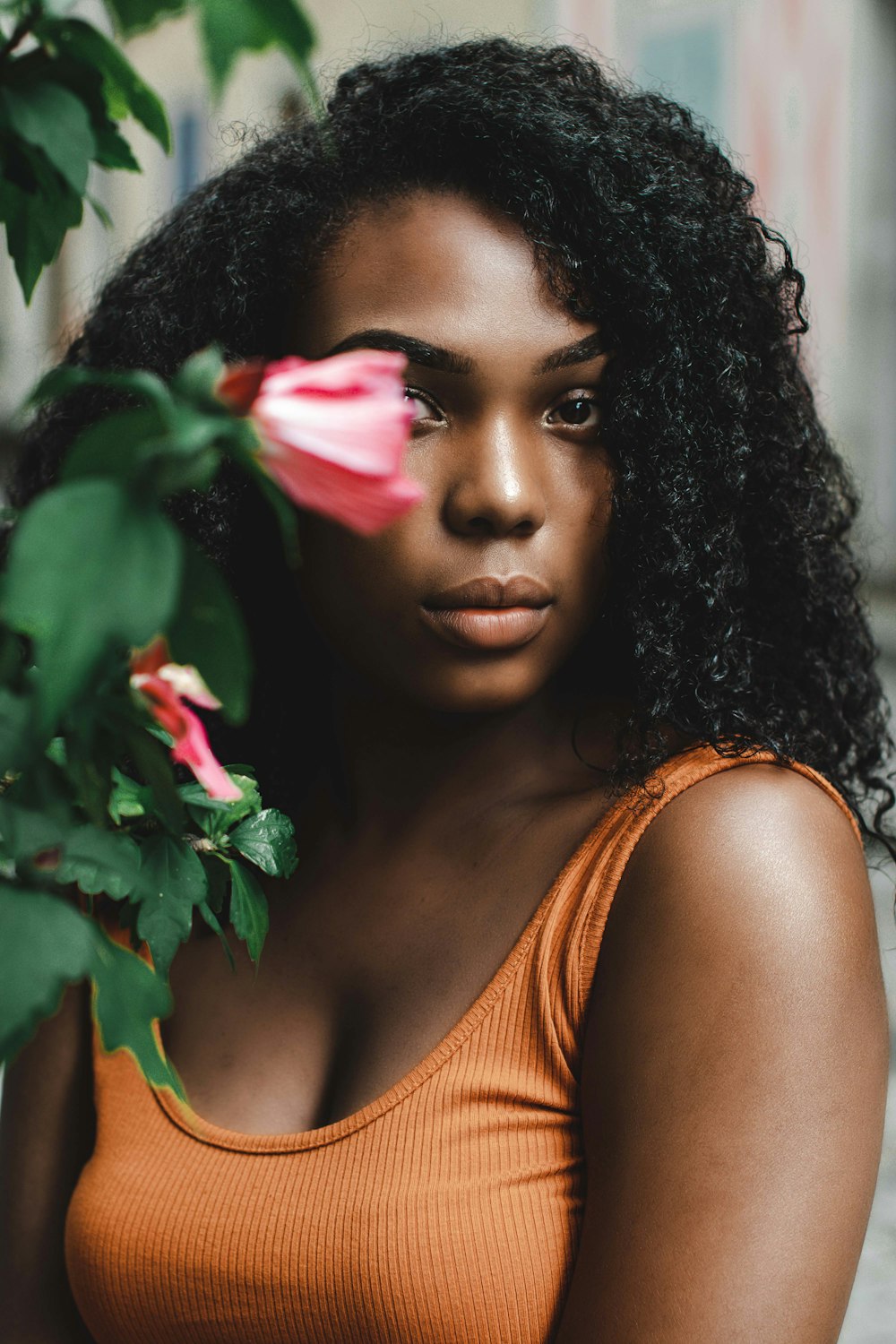 woman wearing orange scoop-neck blouse