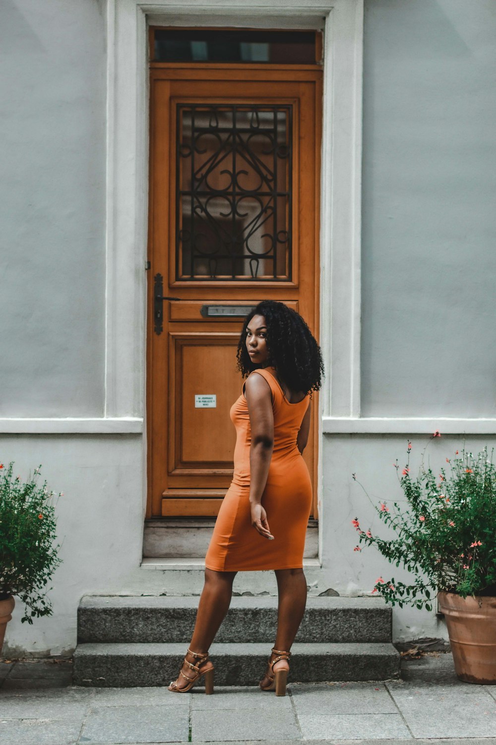 woman standing near the door