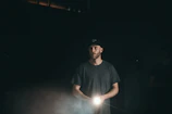 Screenshot of a suspenseful moment in a survival horror game with a player holding a flashlight.