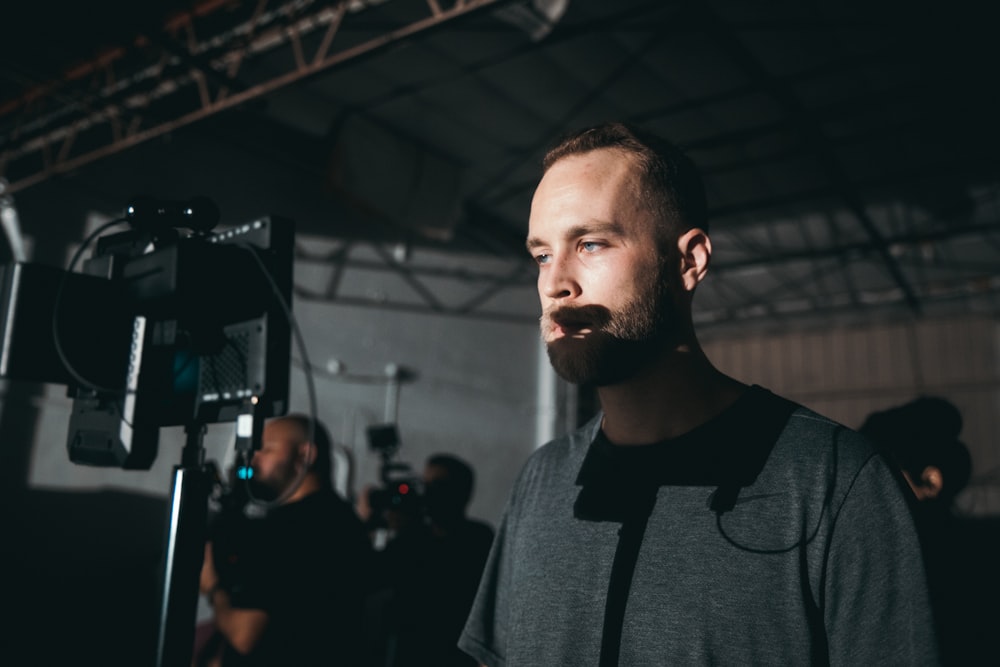 man looking at a camera monitor