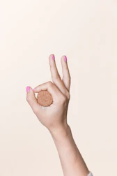 A friendly person clicking a cookie consent button on a website.