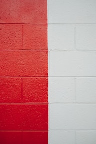 a red and white wall with a red and white stripe