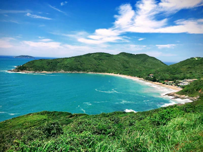 high-ground photography of sea and island during daytime