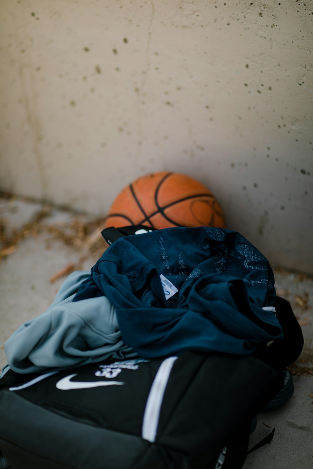 brown basketball and black bag