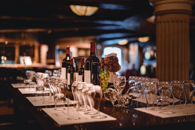 closeup photo of wine bottle and wine glasses on table