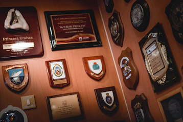 framed tokens and certificated displayed on wall