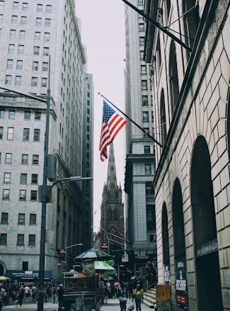 US flag beside street
