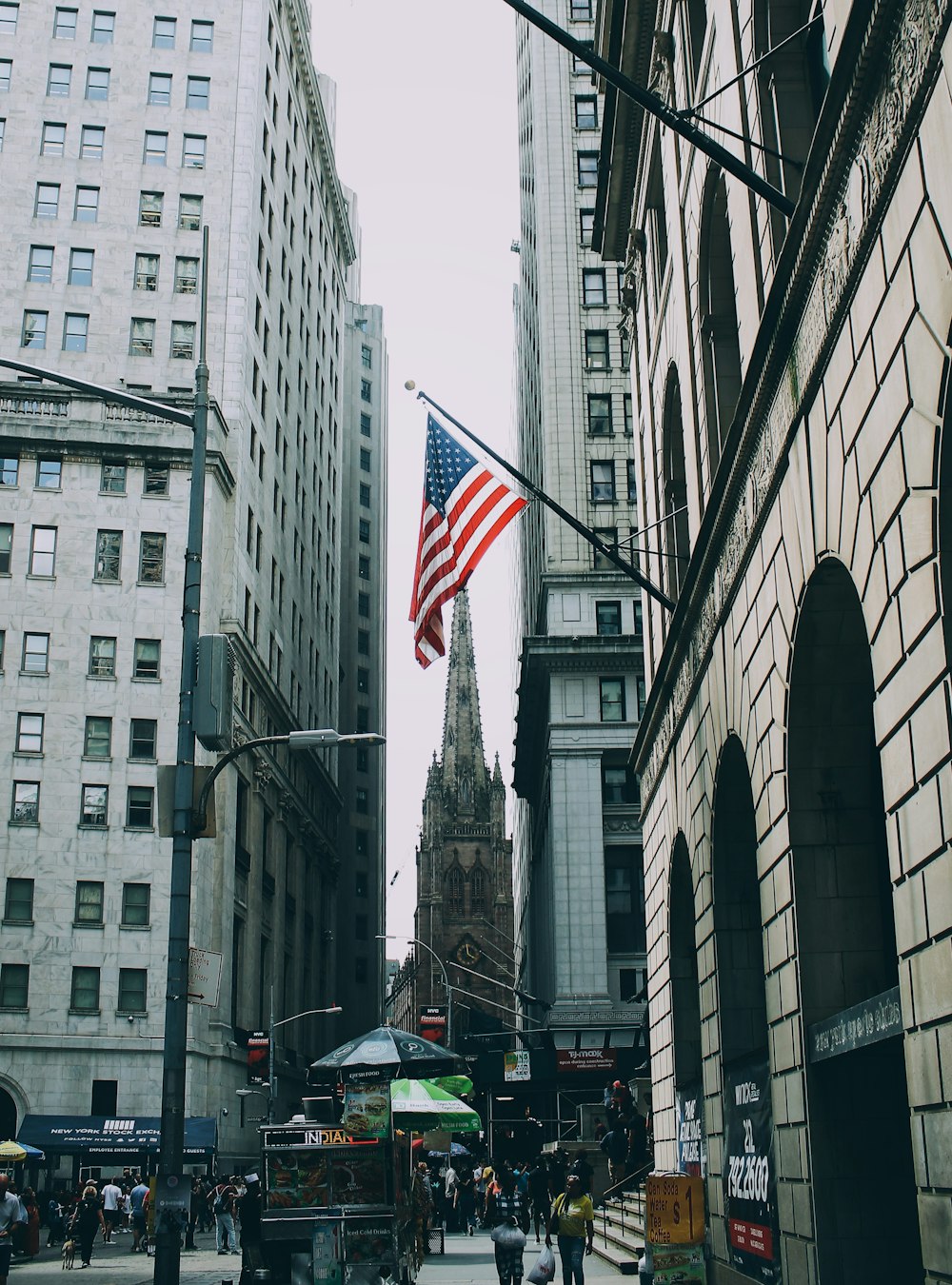 US flag beside street