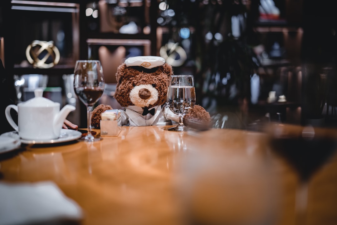 bear plush toy around table