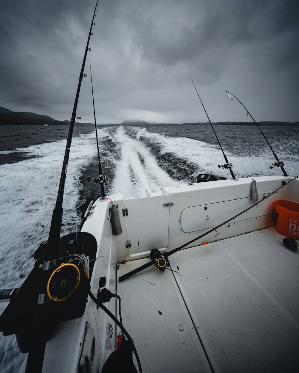 fishing rods on boat during daytime