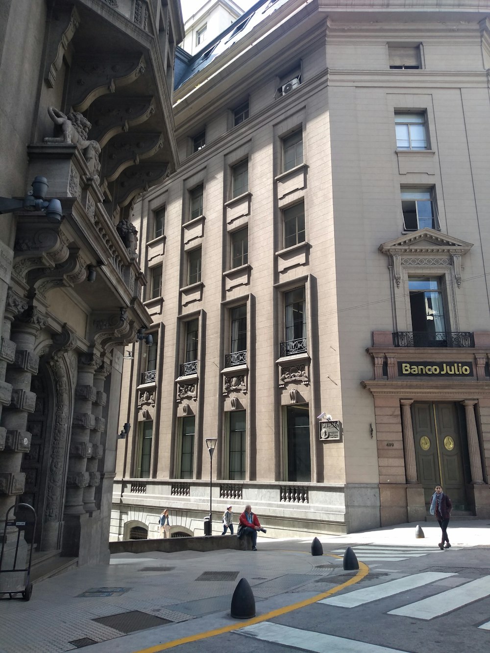 several person walking surrounded by building