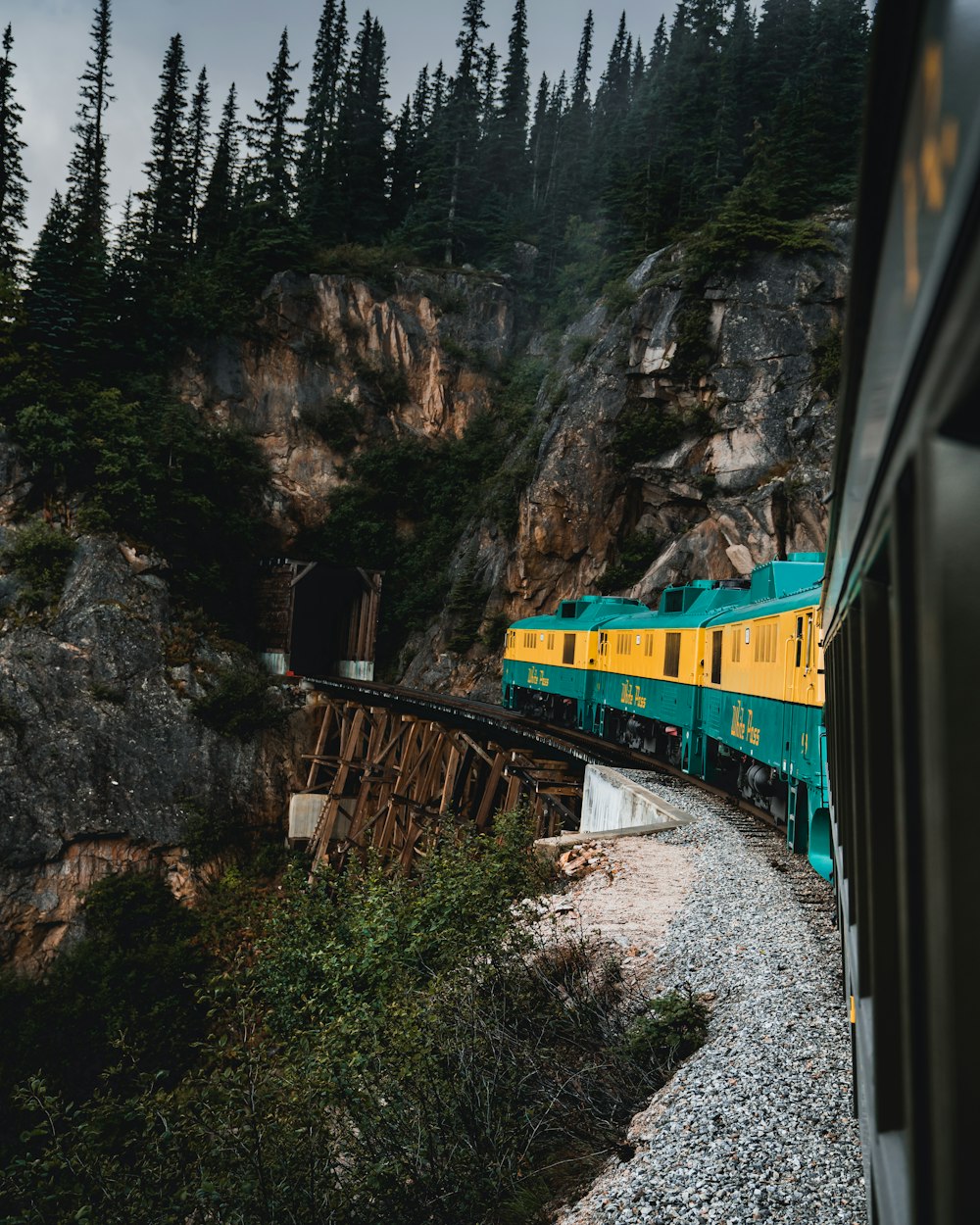 train on bridge about to enter tunnel