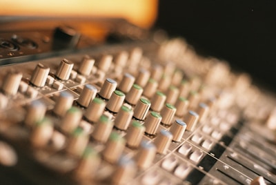selective focus photography of music controller