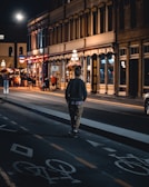 An evening scene of riders celebrating after a local streetboard event under city lights.