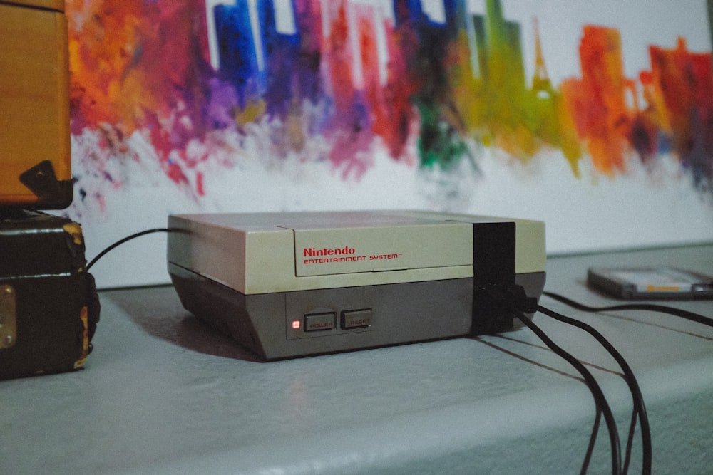 NES console beside wall