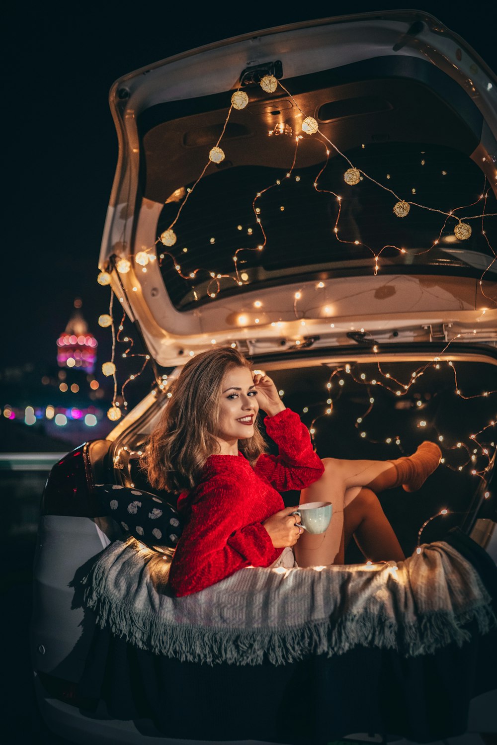 woman sitting on vehicle truck