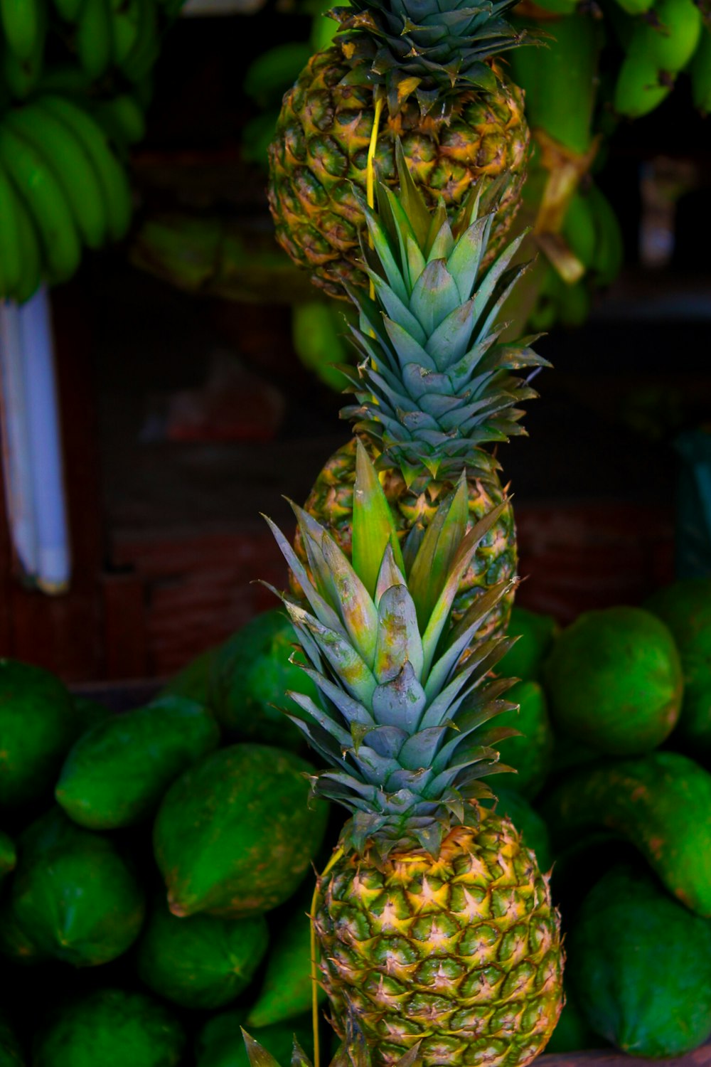 three pineapples stacked on top of each other