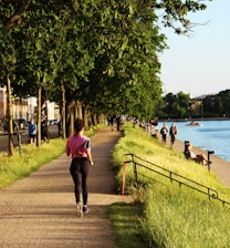 Close-up of a healthy person jogging outdoors in natural sunlight.
