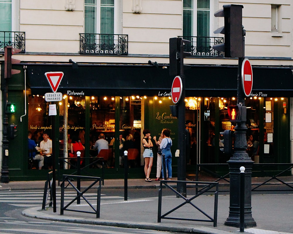 people standing near storefront