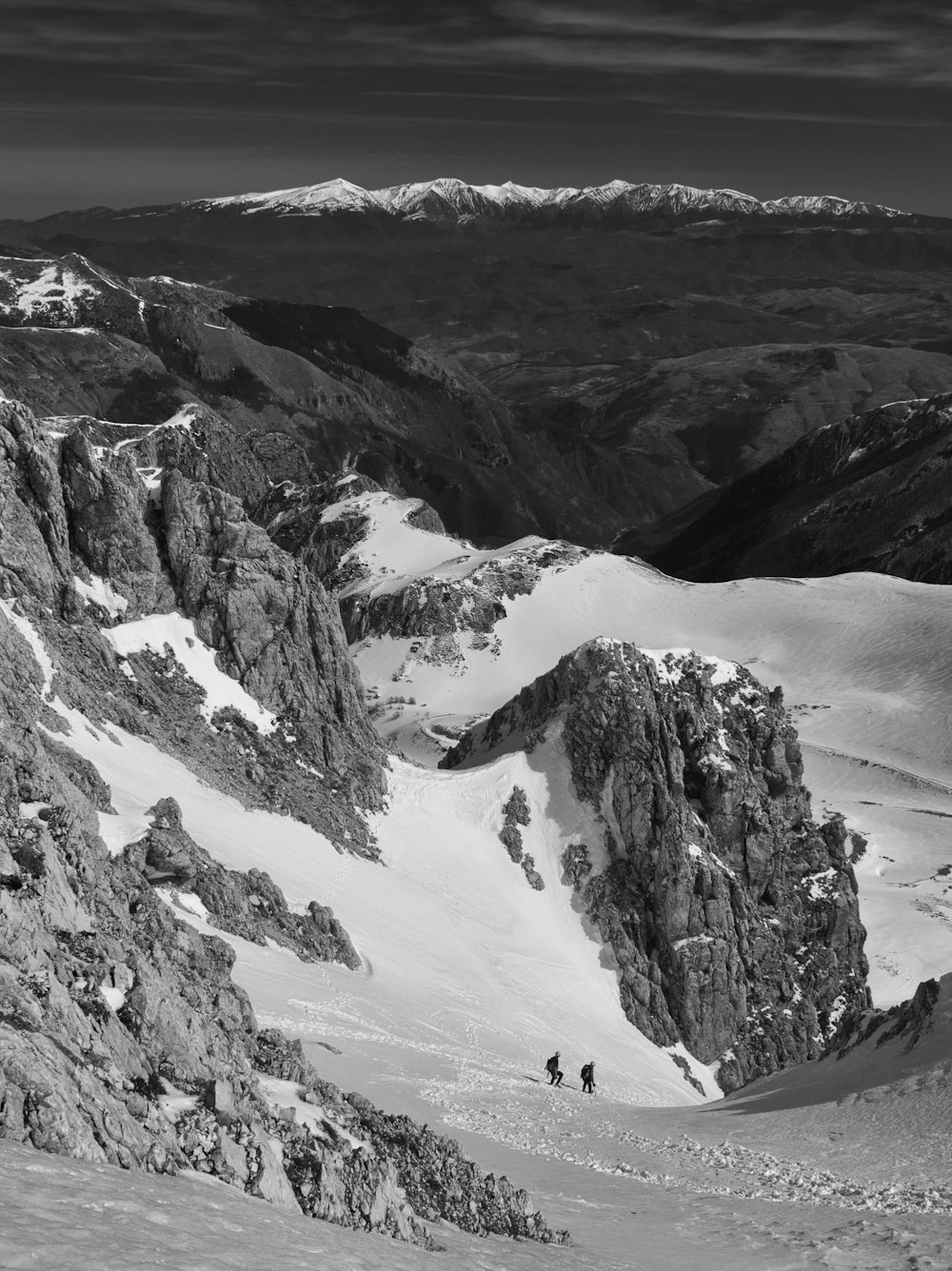 aerial and grayscale photography of rock formation