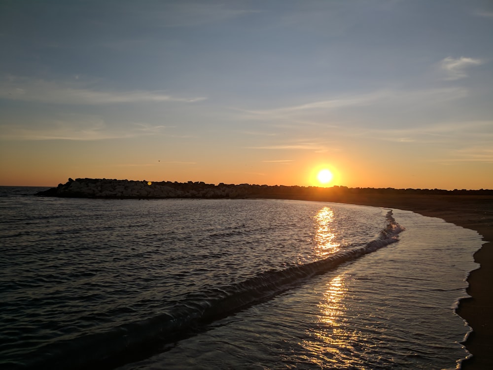 body of water during golden hour