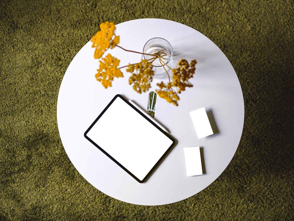 flowers and tablet on table