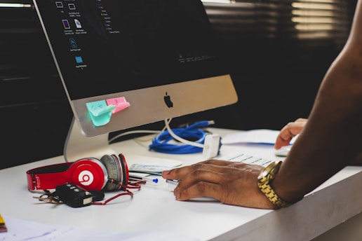 A virtual assistant working on administrative tasks at a desk.