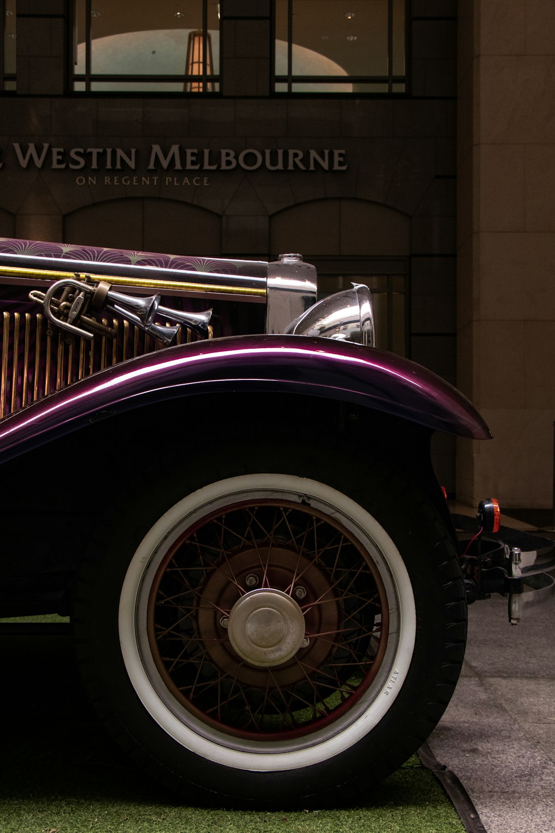 purple vintage car parking near Westin Melbourne