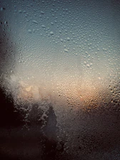 Close-up of moisture meter detecting condensation issues on a window frame.