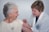 woman inject a woman on left shoulder
