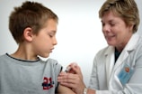 A patient receiving an allergy vaccine injection from a caring nurse in a sterile environment.