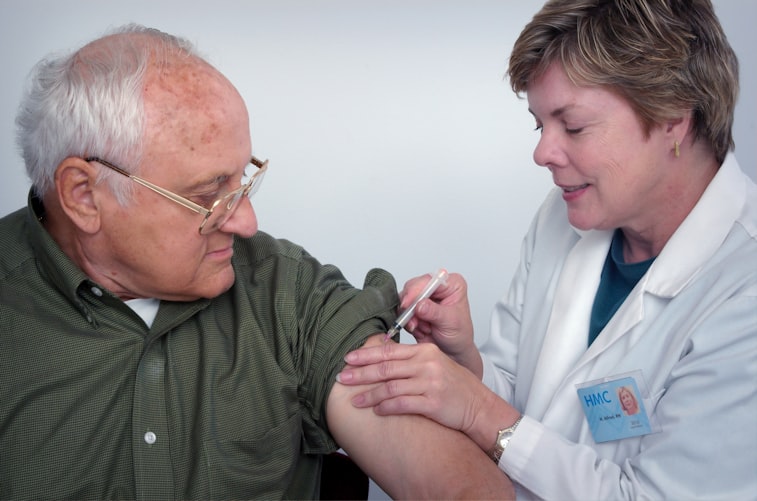 man receiving flu shot