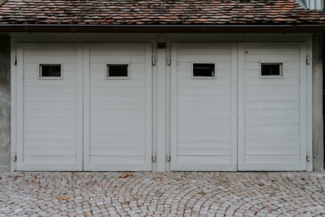 closed white wooden house garage door