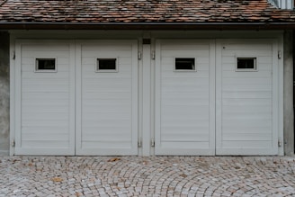 closed white wooden house garage door