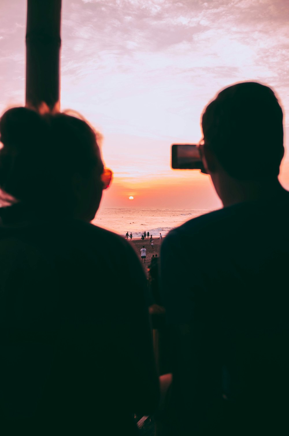 silhouette of man holding smartphone