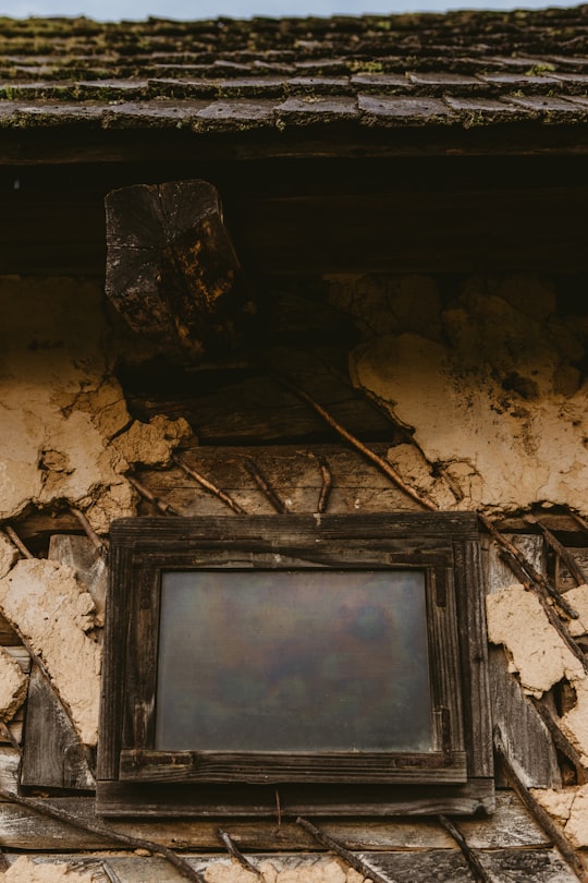 closeup photography of black wooden window in Baia Mare Romania