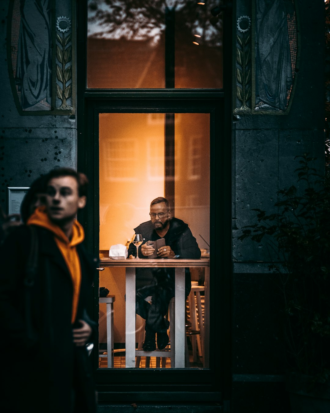 man sitting beside table