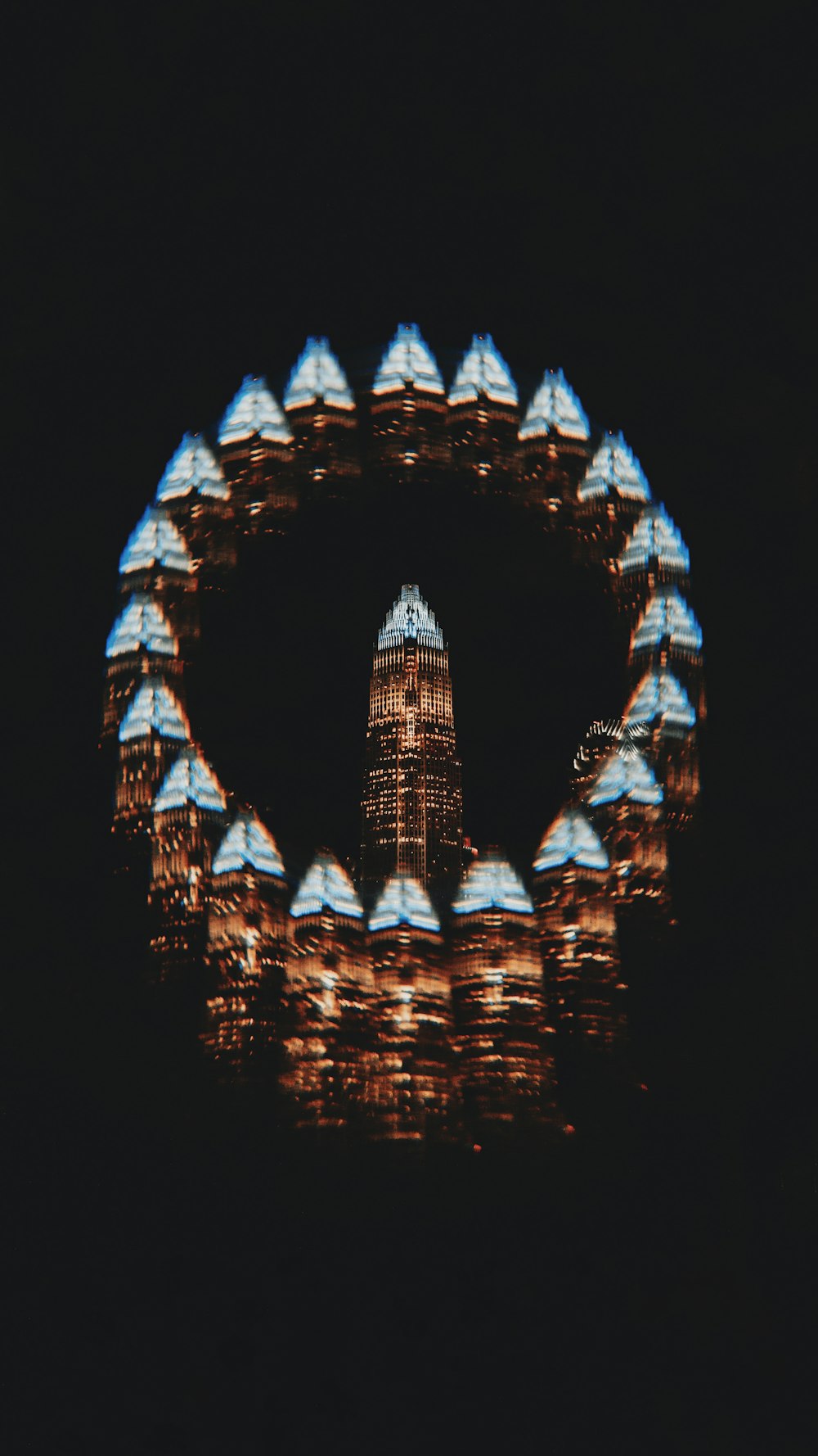 a view of a ferris wheel at night