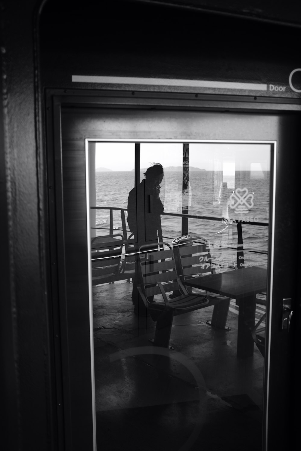 a person standing on a boat looking out at the water