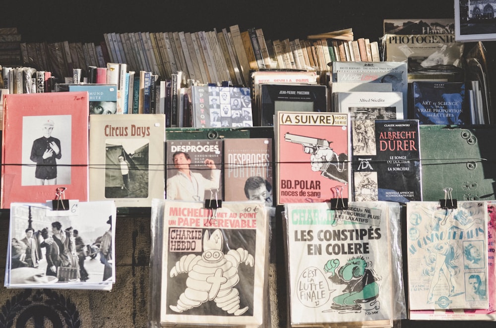 a bunch of books that are on a wall