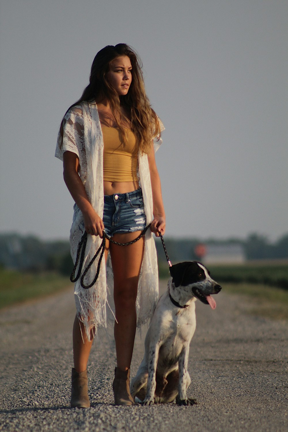 woman holding dog leash