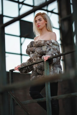 photography poses for women,how to photograph woman standing holding on top green metal railing