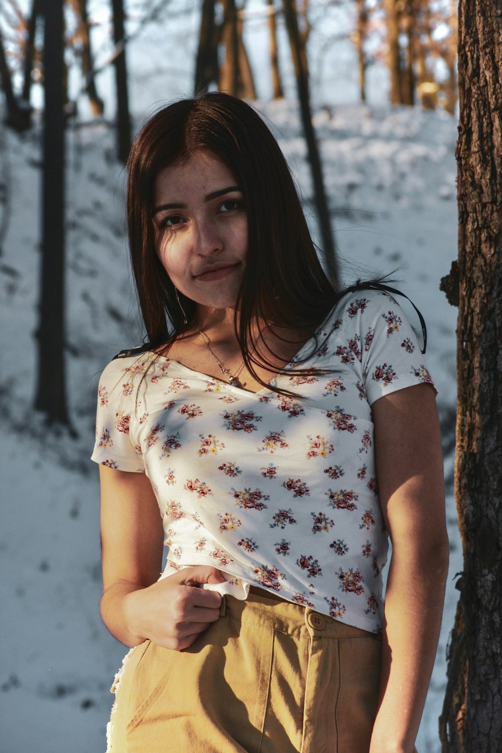 woman standing beside tree