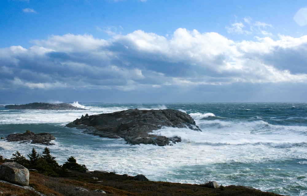 sea waves crashing on rocks